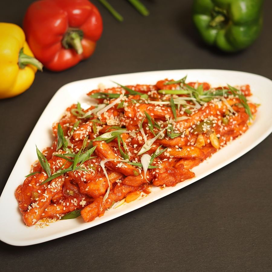An image of french garnished with spring onions and coriander leaves in a platter at the restaurant of Five Elements Hotels North Avenue, Delhi