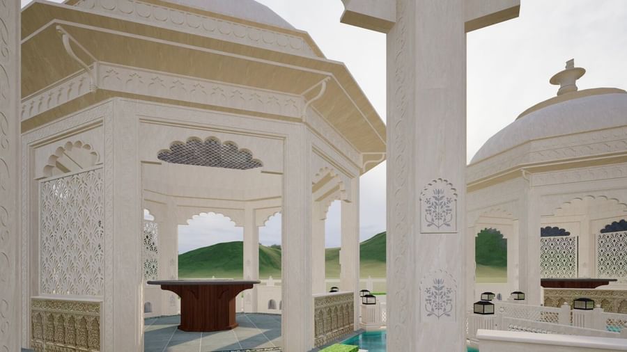 the close up shot of the gazebo at Panch Mahal with a intricately carved pillar, featuring a centre table, ornamental lattice screens, and dome shaped roofs - Kaldan Samudhra Palace