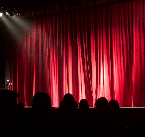  The theatre stage is covered by a curtain
