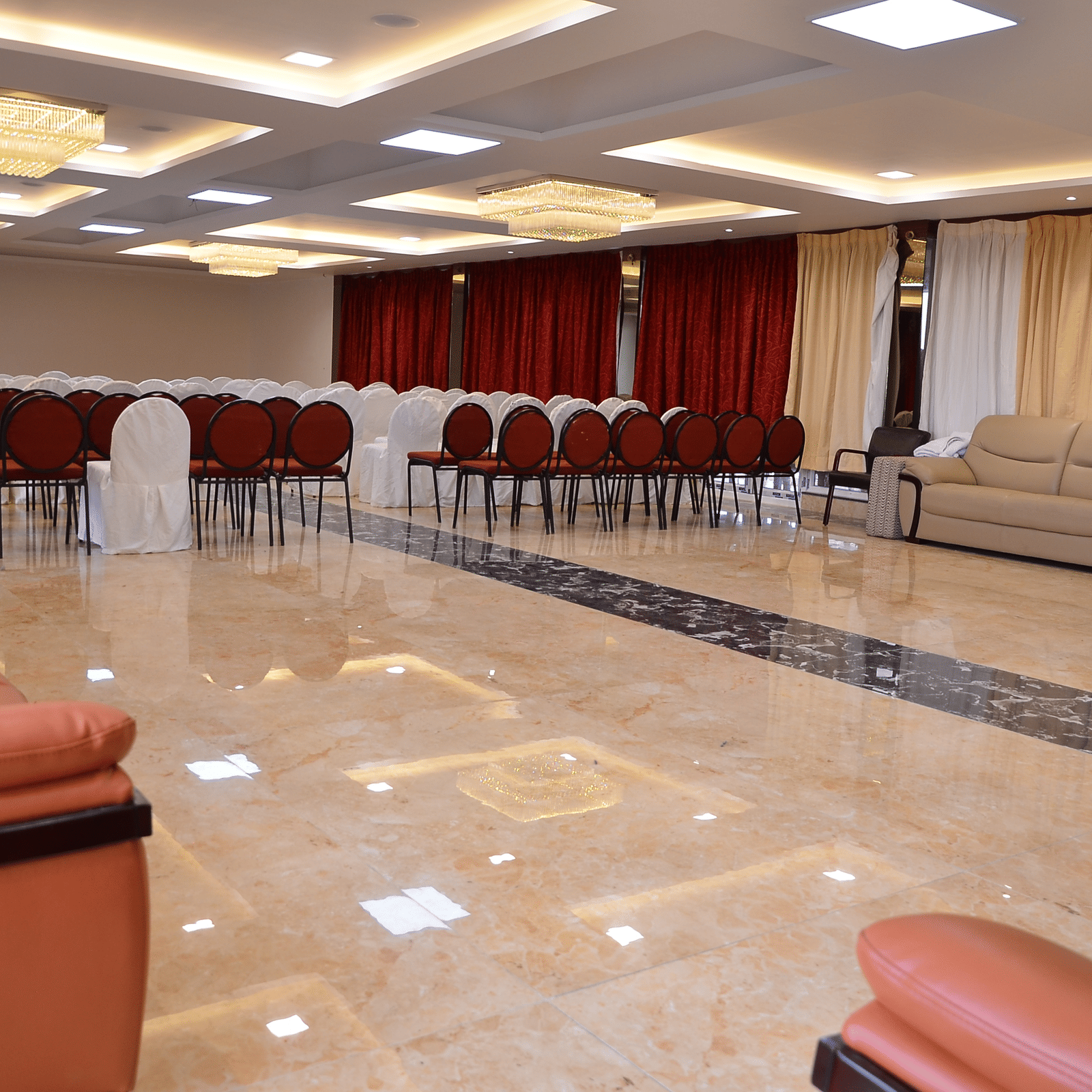 Spacious banquet hall with elegant lighting and comfortable seating, ideal for events and functions - Benzz Park, Kodaikanal