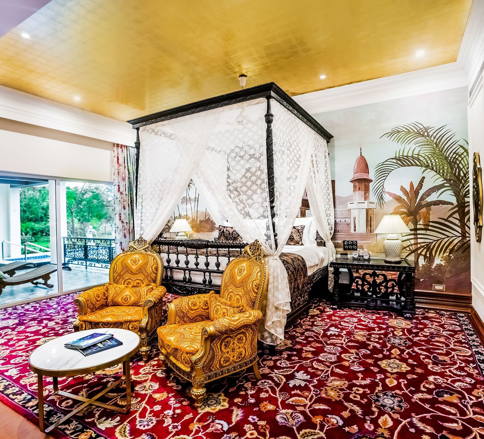 two yellow coloured sofas kept in front of a king size bed - Mayfair Tea Resort, Siliguri 