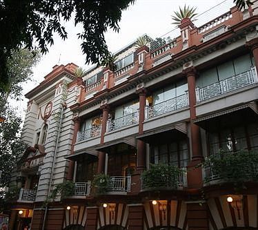 A facade image of The House of MG
