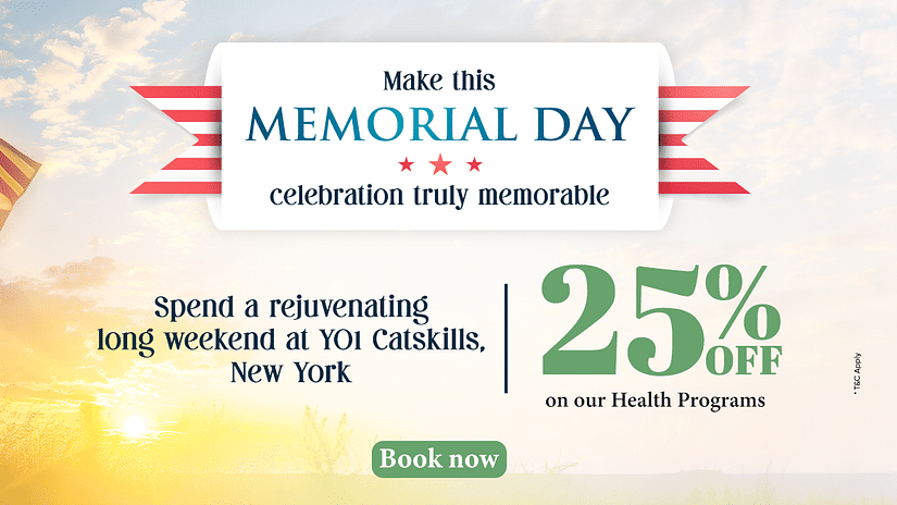 A soldier standing in front of the US flag as the sun is rising from the horizon as the text says - Make this Memorial Day celebration truly memorable. 25% off on our health programs at YO1 Longevity & Health Resorts