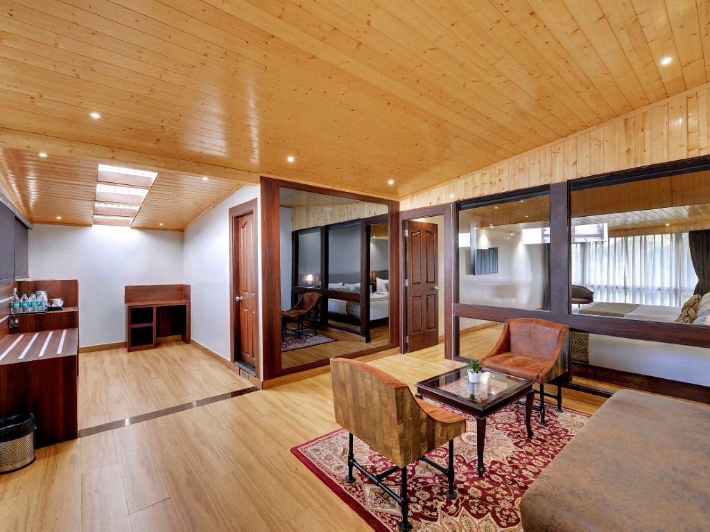An image of a room with sofa sets, centre table and minimal decoration - Sumitel Vista TV Tower