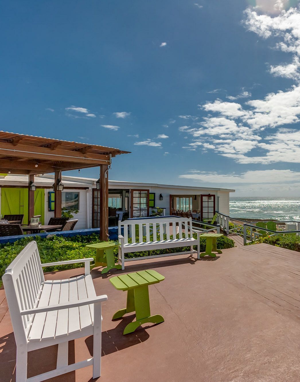 Brick-paved area with oceanfront view and patio seating | Abaco Inn