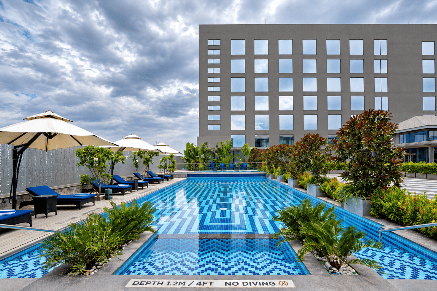 Modern Rooftop Pool Under Cloudy Skies