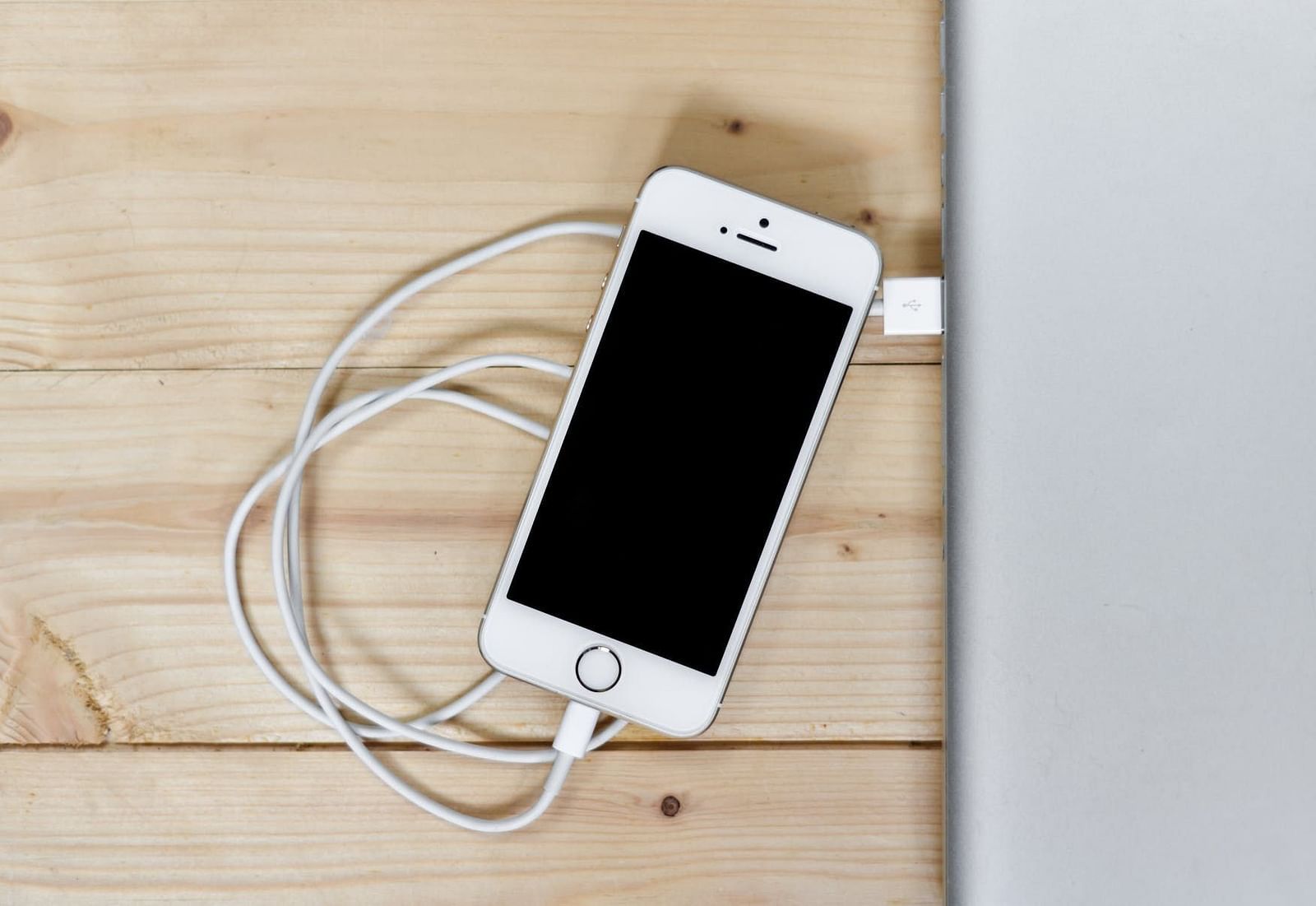 Image of a phone with a wire connected to it.