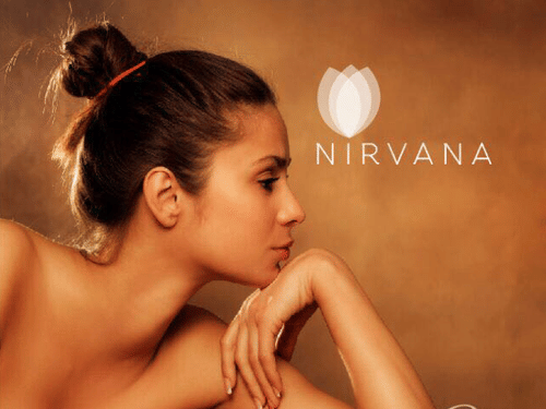 Nirvana Spa logo and a woman lying on a massage bed with flowers and spa items.