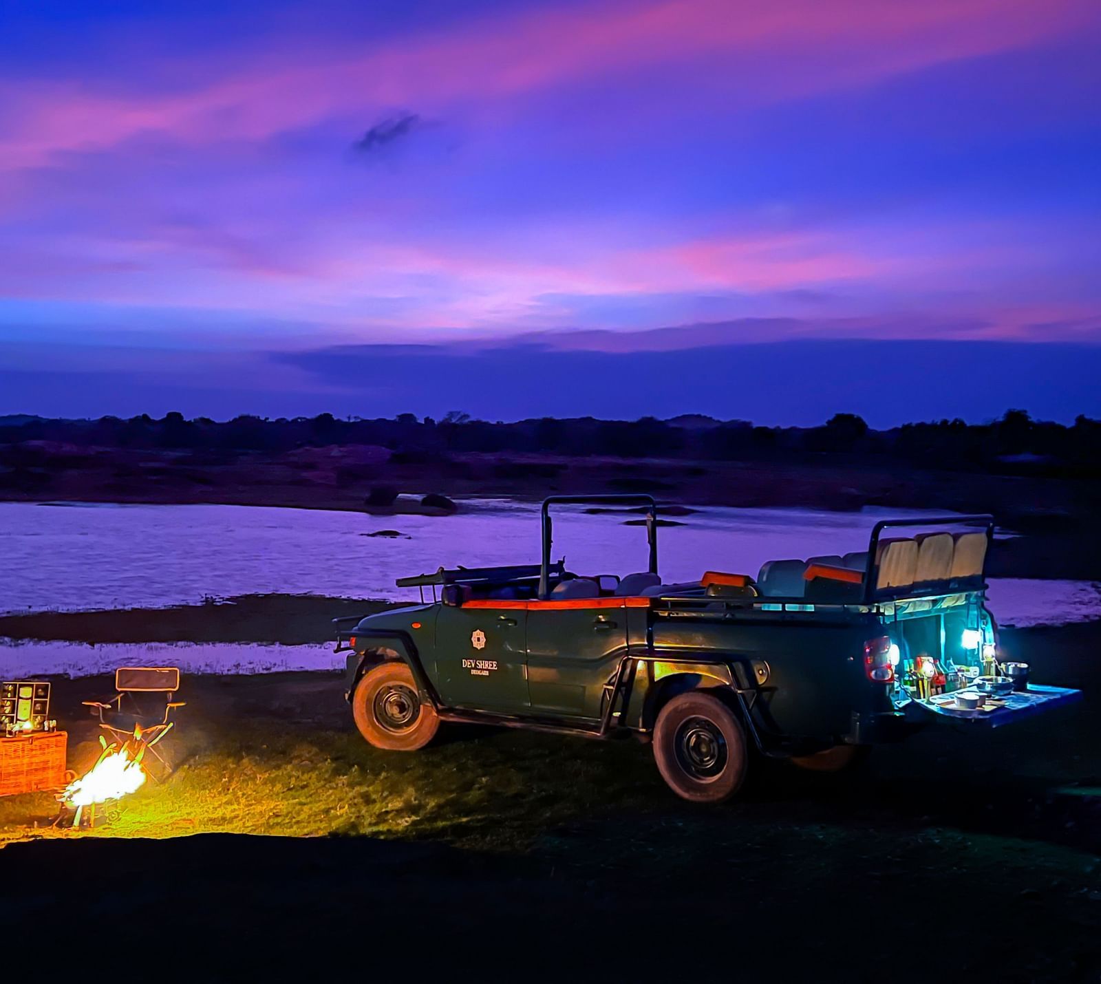 image showing the camping experience near a lake at Sunset at dev shree, deogarh