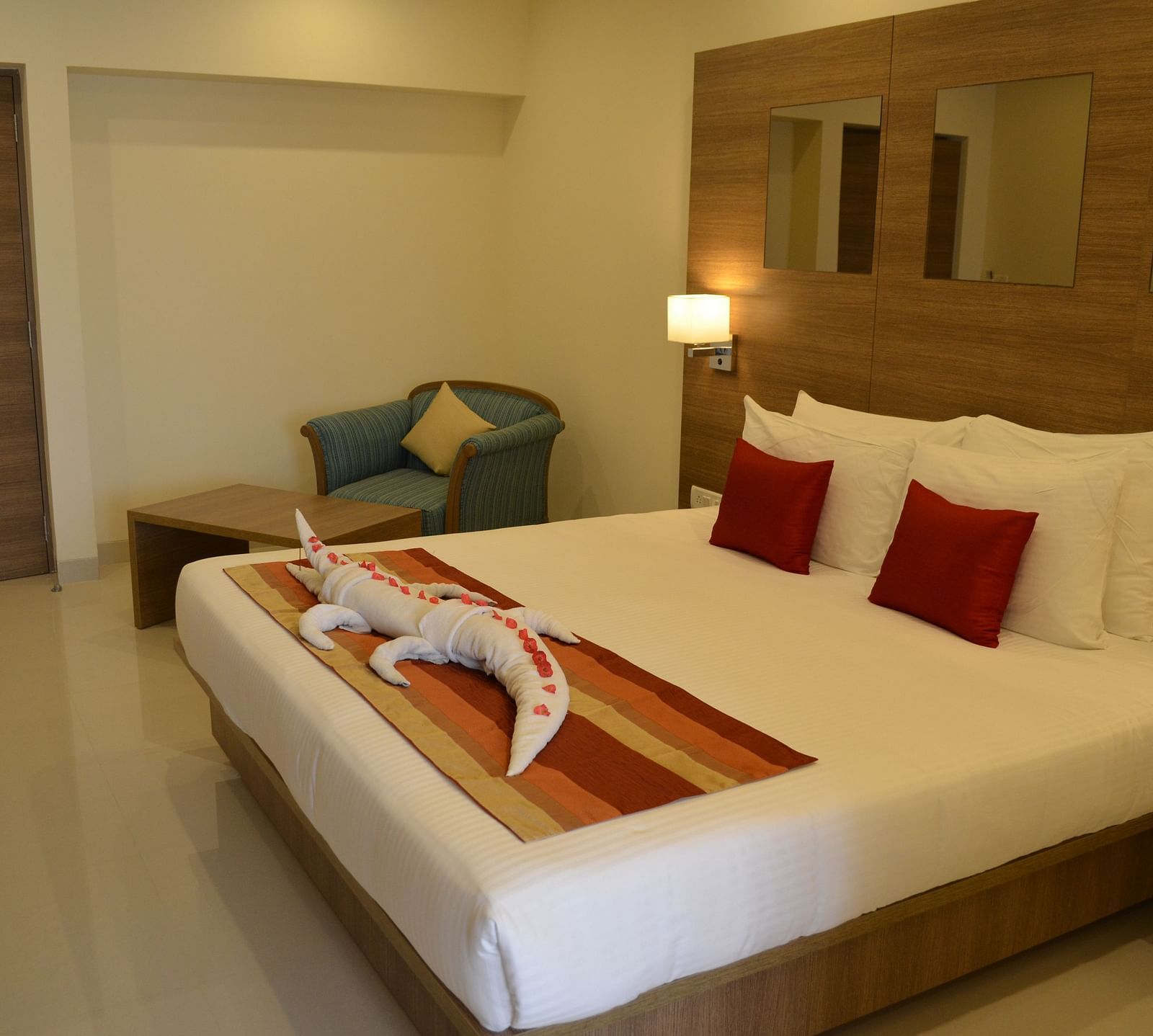 An image of a king size bed of a room at Regency Tiruttani by GRT Hotels.