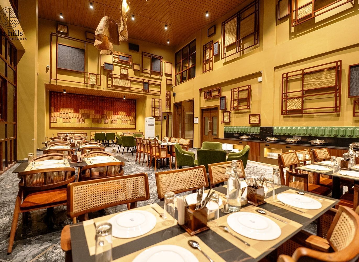A spacious and well-lit restaurant interior with elegant decor and a welcoming atmosphere for guests - Sea Hills Resort, Swaraj Dweep (Havelock)