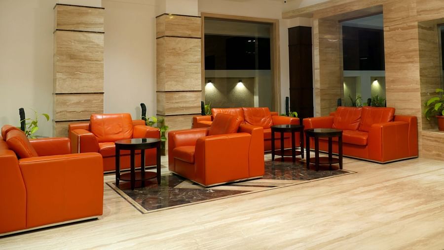 lobby with comfortable chairs and warm lightining of ASR Parklane, Hosur