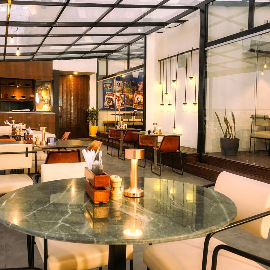 An image of the rooftop cafe at Marasa Sarovar Portico, Rajkot with beautiful outdoor ambience .