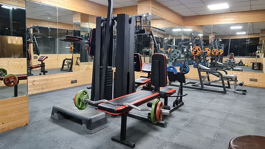 ull view of the fitness centre at Shaheen Bagh with multi-functional machines and spacious layout.