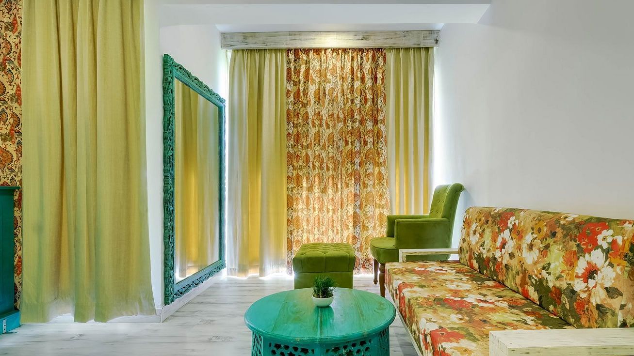 Side view of a room with sofa and coffee table at Summit By The Ganges Beach Resort & Spa, Rishikesh