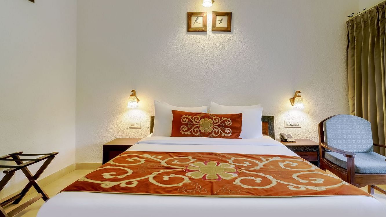 Image of a room with bed and sitting area at Summit By The Ganges Beach Resort & Spa, Rishikesh