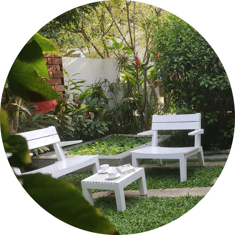 White garden chairs and table outdoors-Amanvana Spa Resort, Coorg - Luxury Resort