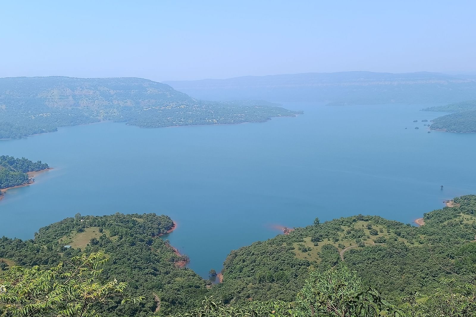 A panoramic view of a river winding through lush landscapes