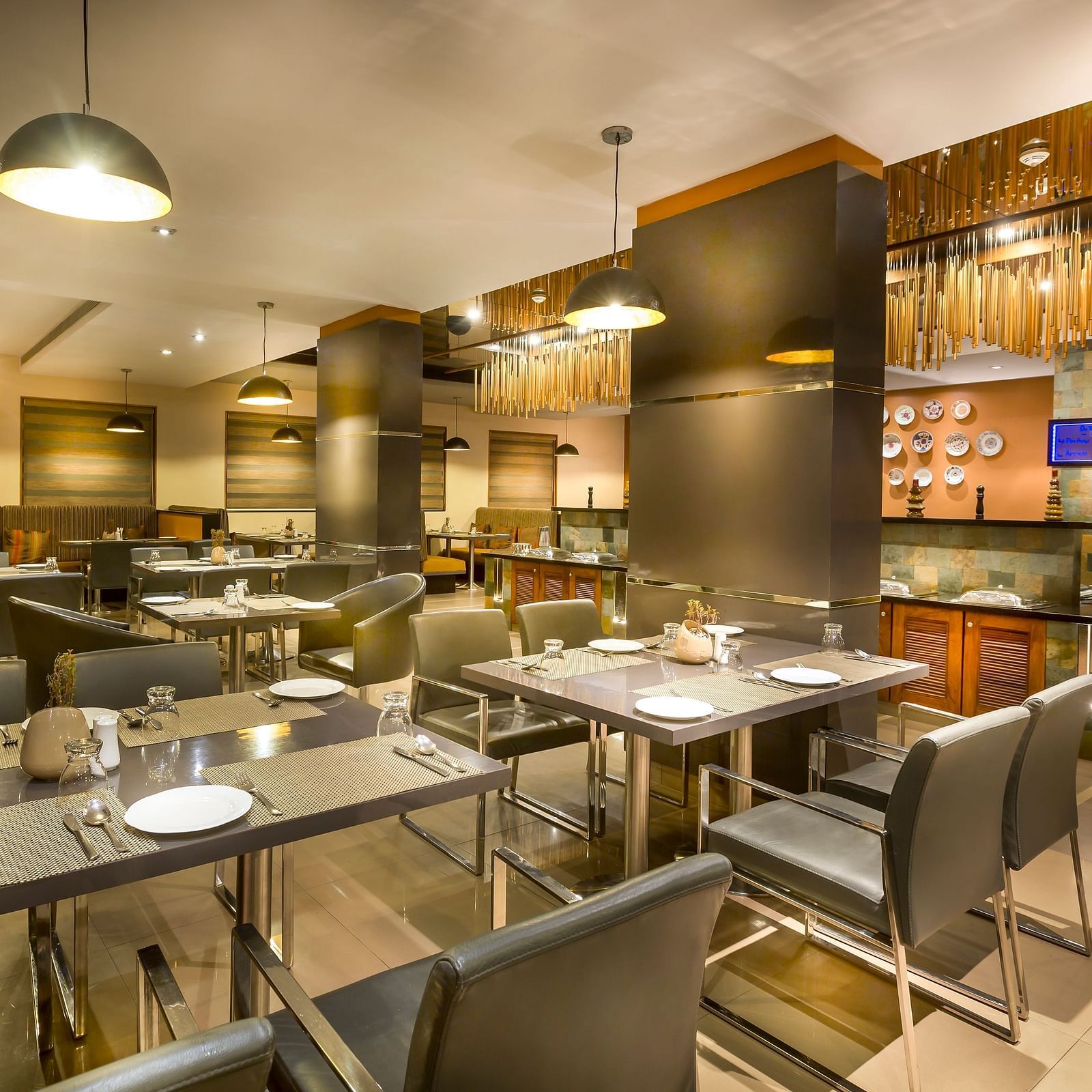  Modern restaurant interior with dark wood accents, leather chairs, and ambient lighting.
