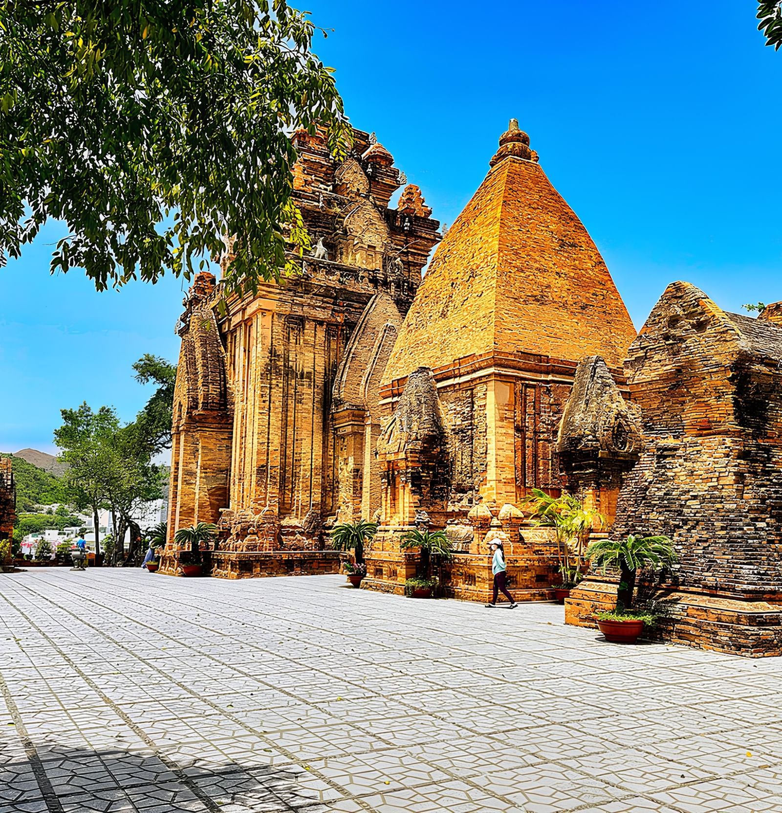 Ancient temple ruins with golden stone architecture and vibrant surroundings near Alibu Resort, perfect for cultural explorers.