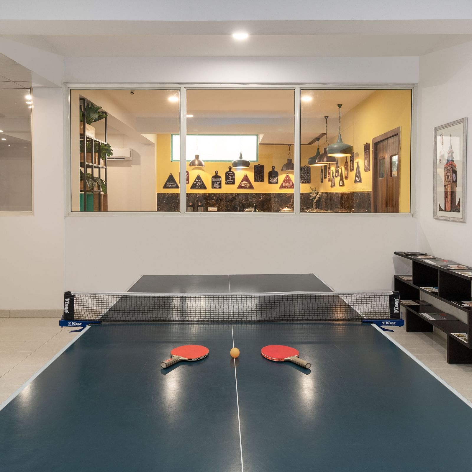 Table Tennis Court at Inde Hotel Cyber City  with tennis bats and a ball