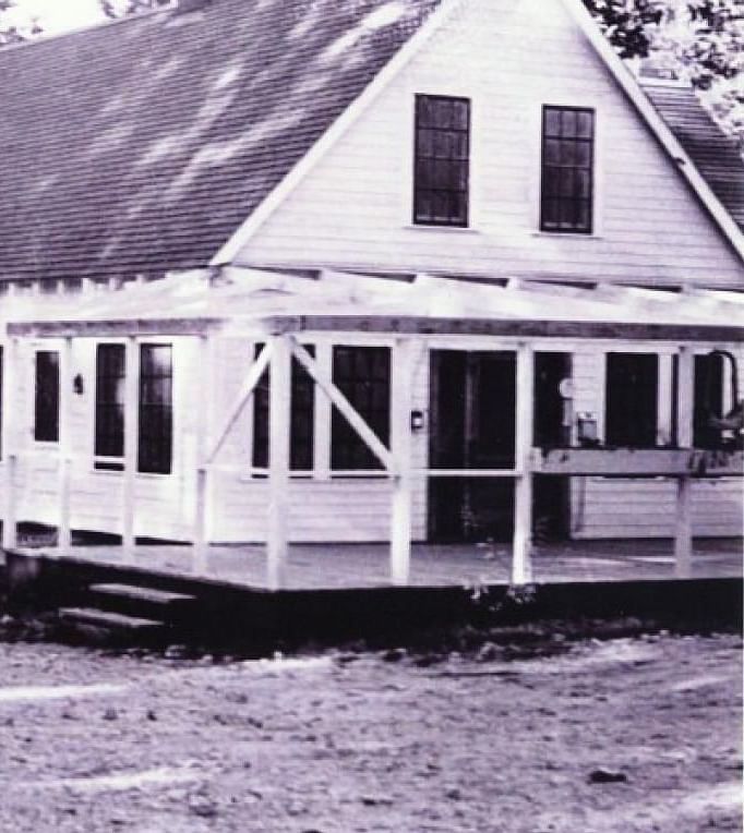 A black and white image of the exterior of Shaver Lake Village Hotel.