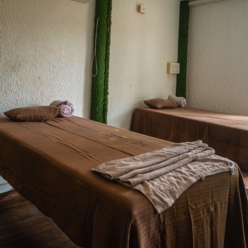 Two single beds placed inside our spa in Mandrem 