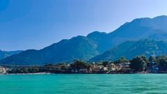 a beach next to hills