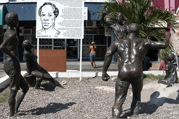 The Sam Sharpe Square, a monumental part of Jamaica's history. It features statues of Sam Sharpe and people listening to his speech against slavery.