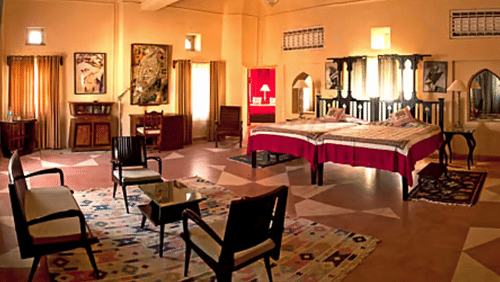 Neemrana Fort-Palace built across the Aravalli hills with historic stone architecture and landscaped terraces.