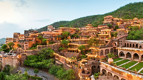 Tijara Fort-Palace Rani Mahal room with traditional interiors, furniture and decorative artwork
