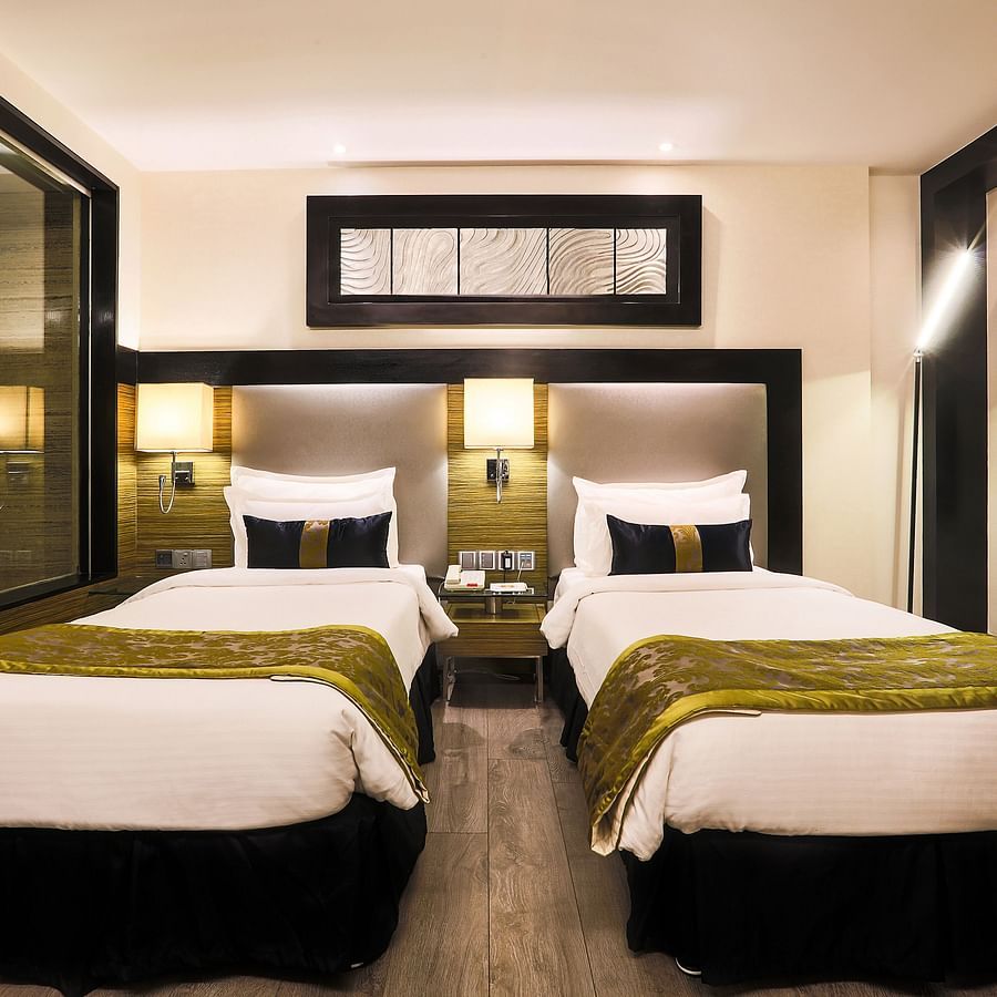 The Empresa Boutique Hotel - the twin beds offered by the Executive twin room in Andheri