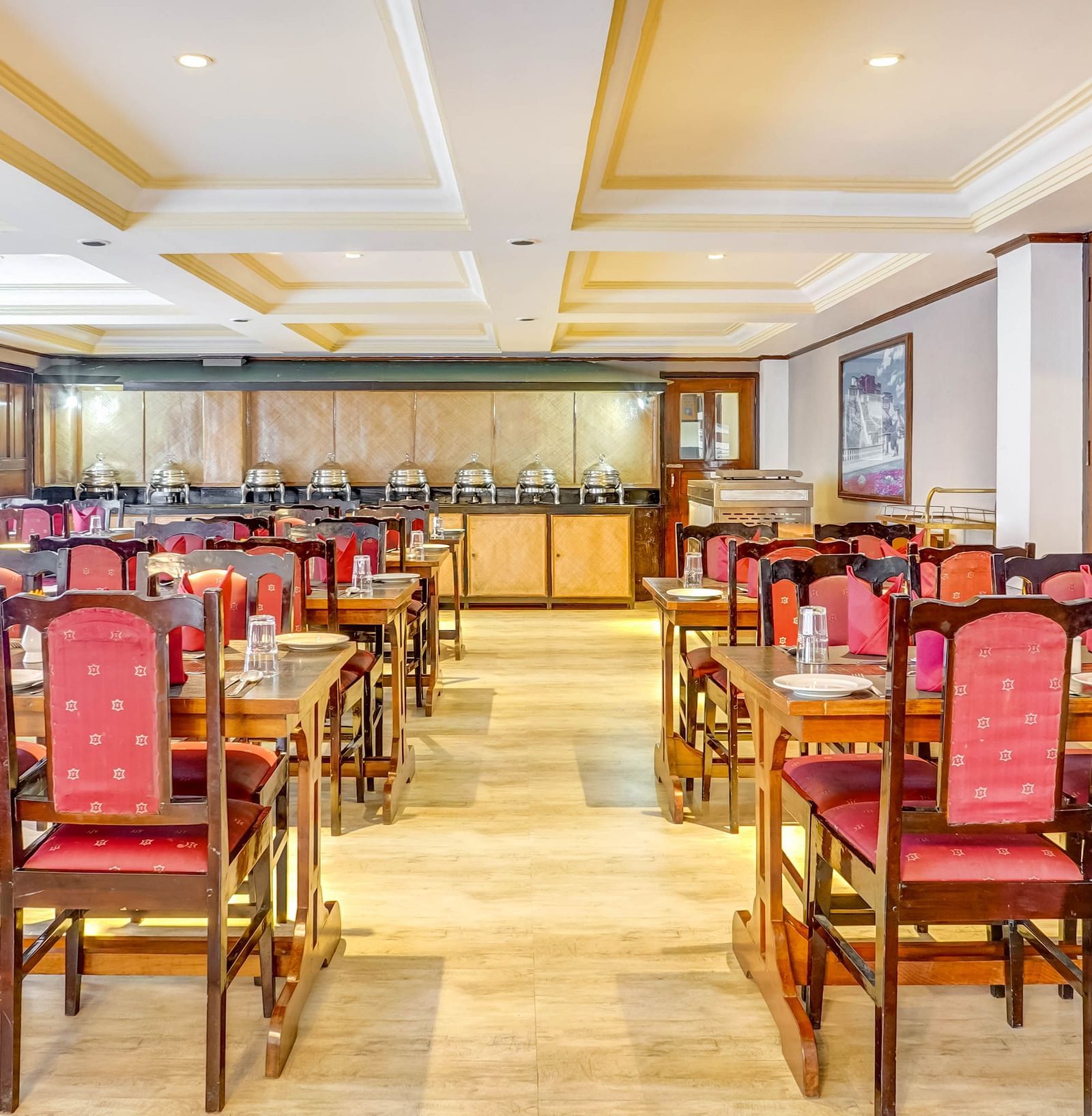 Image of  a dining space with neatly arranged chairs and tables at Summit Tashi Ghang Heritage Resort, Pelling