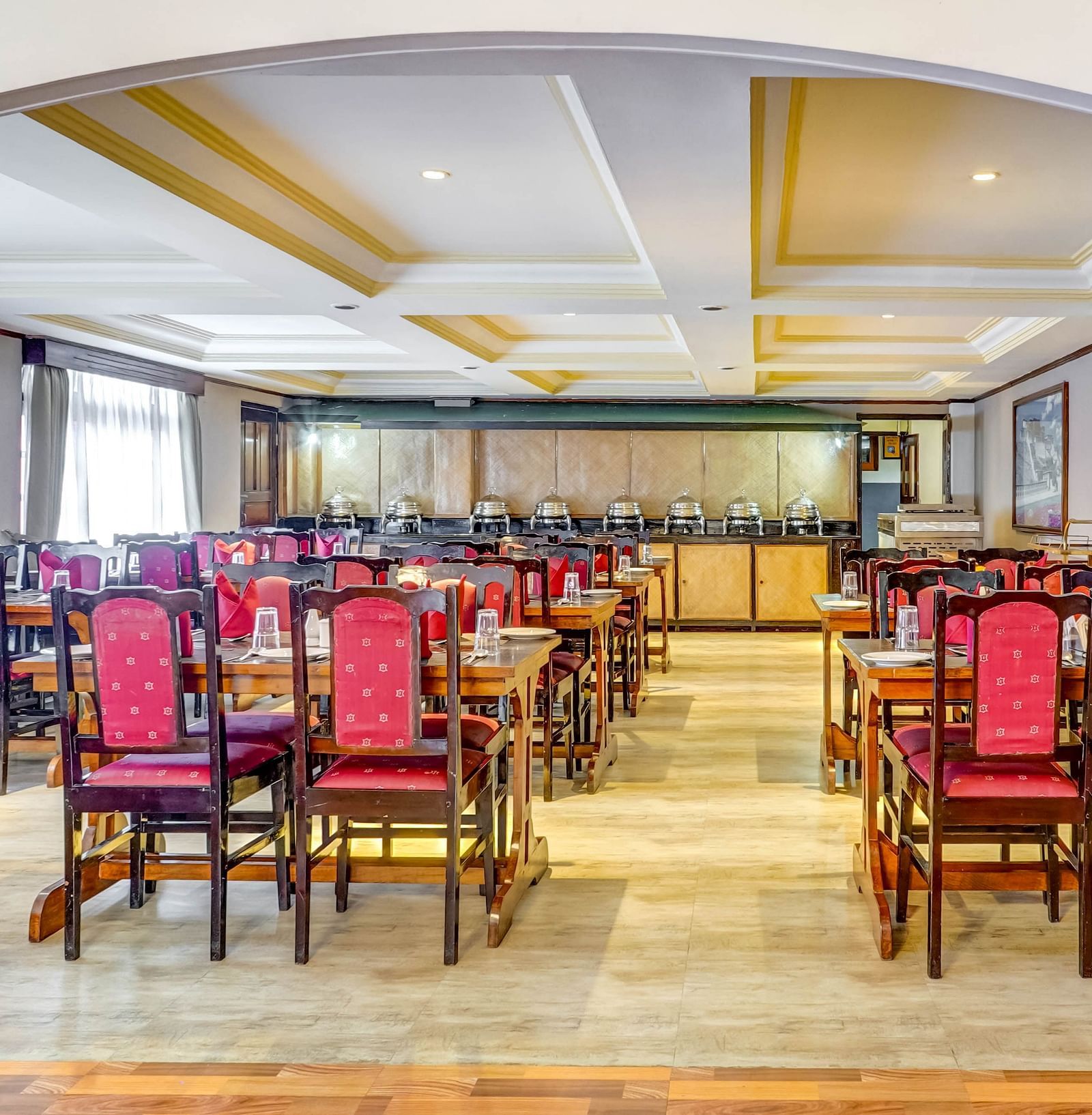 Image of  a dining space with neatly arranged chairs and tables at Summit Tashi Ghang Heritage Resort, Pelling