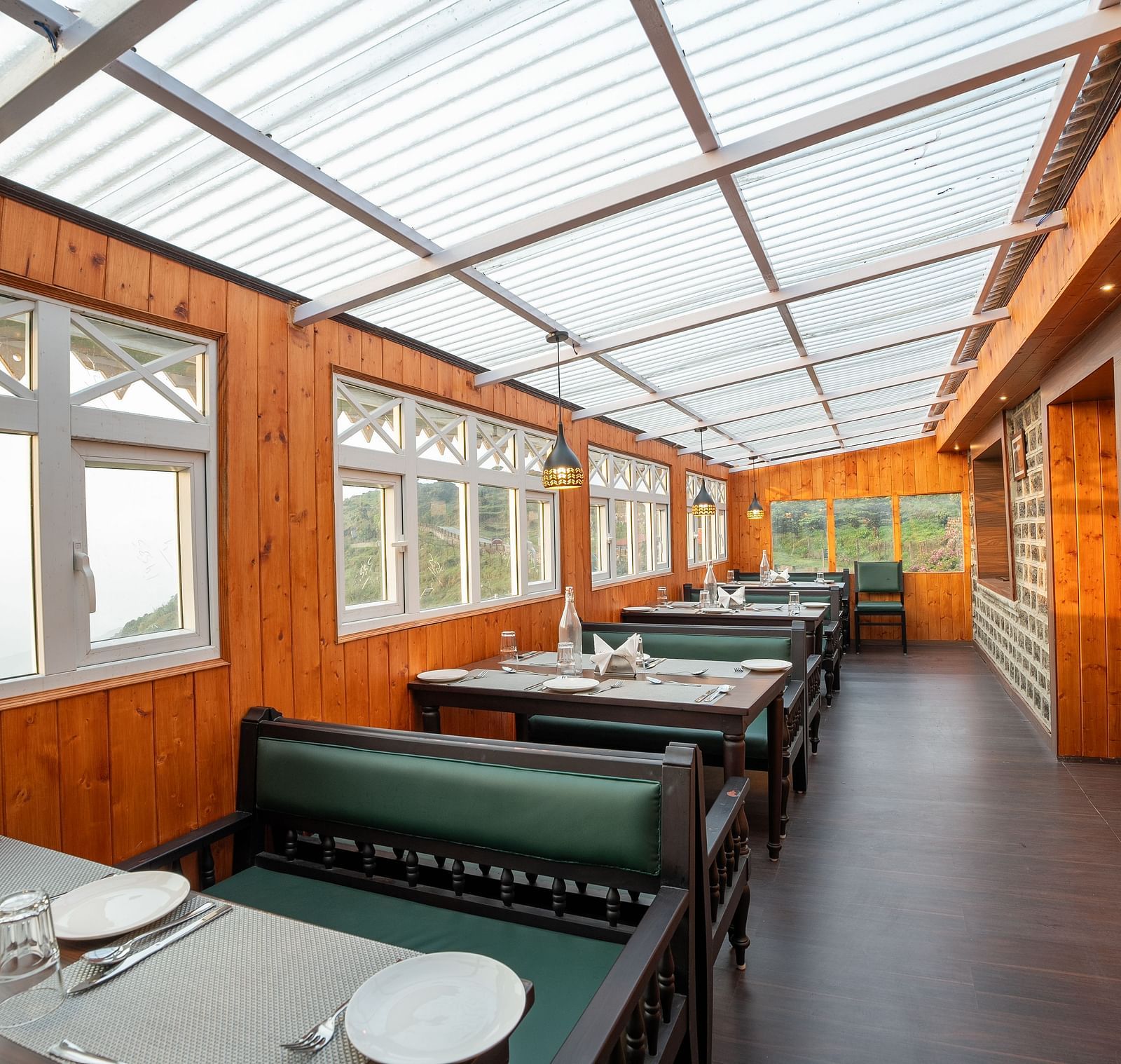 Seating arrangement in the restaurant at Poshtel, Meghma
