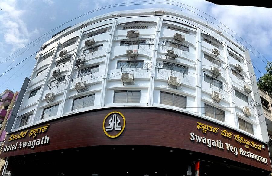 Hotel Swagath, Bangalore facade under a blue sky