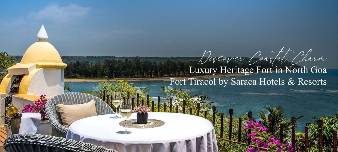 Rooftop dining setup with a scenic ocean view at Fort Tiracol, Goa.