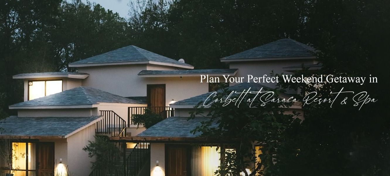 Saraca Resort & Spa, Corbett with tiled roof and lush gardens, offering a peaceful retreat.