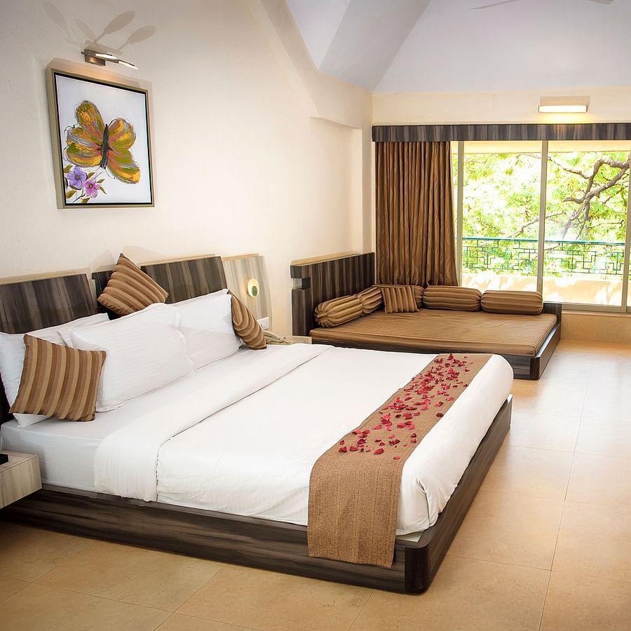 Adamo Resort Matheran - A close up view of the bed in Regency Room