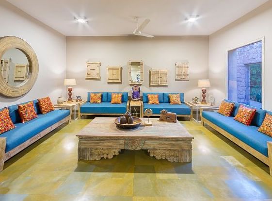 An image of a seating area with sofa set, table and decorative items - MANVAR Resort & Desert Camp