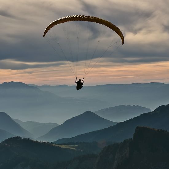 person doing paragliding