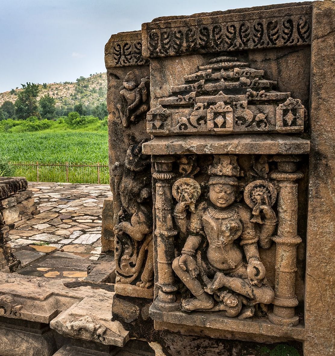An image of beautiful carvings of gods on the walls of Neelkanth Temple