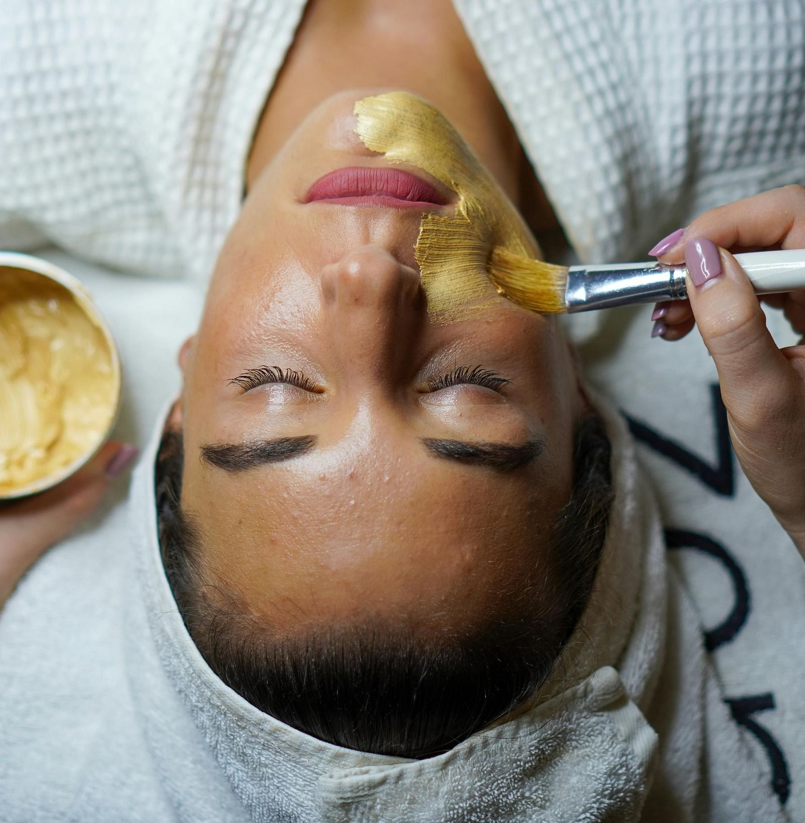 a woman getting facial