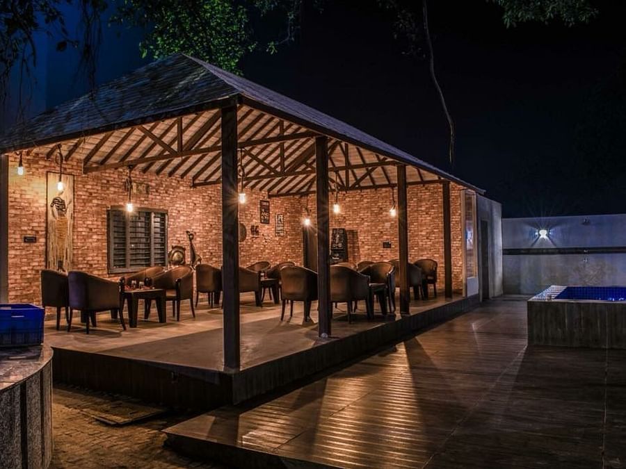 The open-air cafe pictured during the night - Wedlock Greens Hotel Resorts Dhanbad