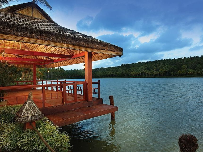 A balcony setup overlooking the lake with a scenic natural view