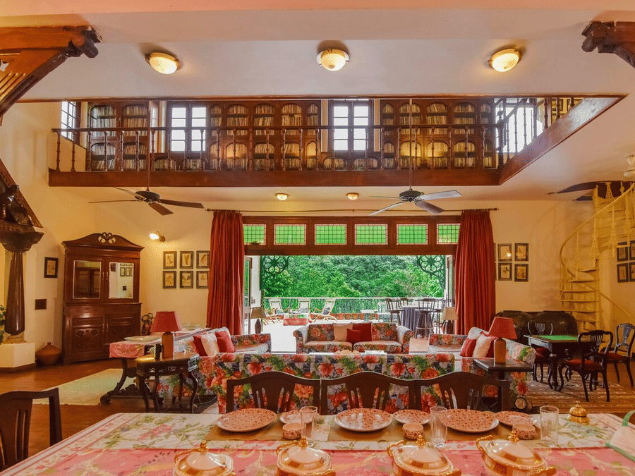 The restaurant of Shaheen Bagh resort with plush wooden furnishings and ornate deconations.