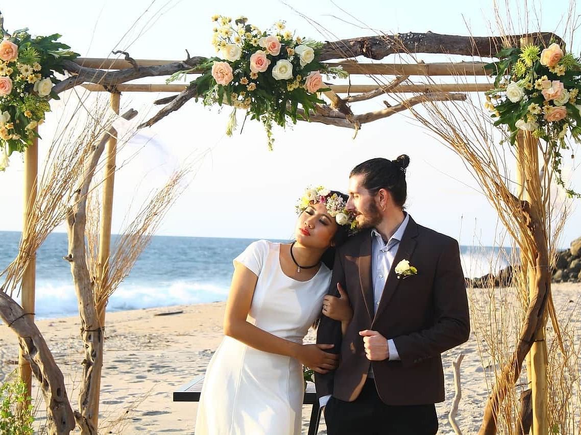 A couple getting their pre-wedding photoshoot done at a beach