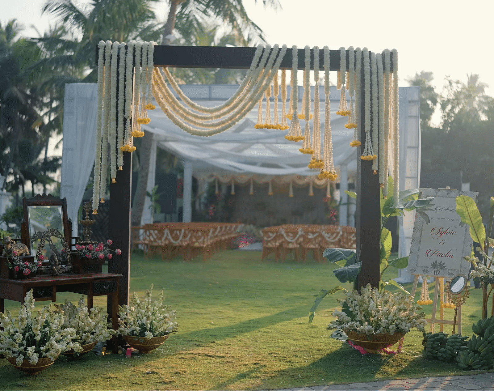 Outdoor wedding decor spread across a lawn.