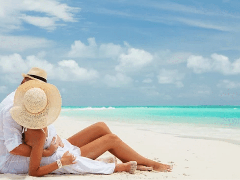 An image of couple relaxing on a pristine beach - S Hotel Montego Bay, Jamaica