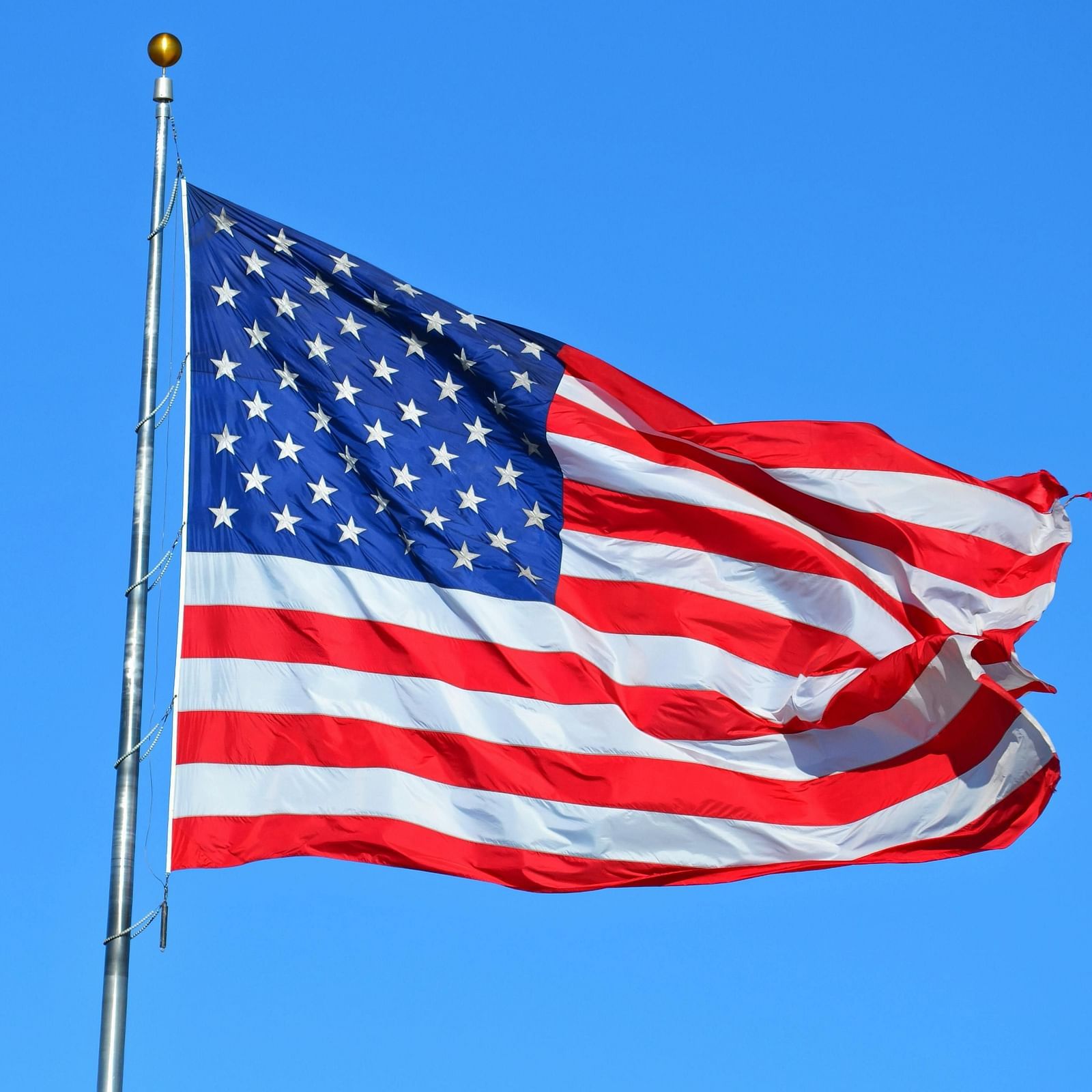 US flag set against a clear sky